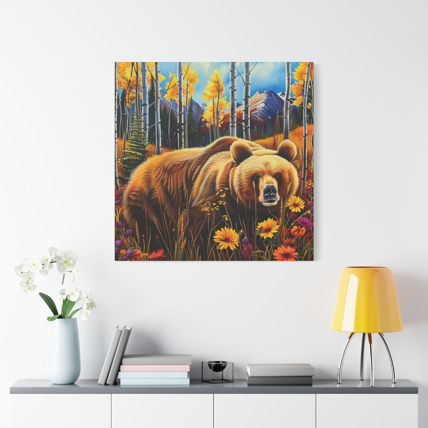 Brown Bear in Mountains smelling flowers
