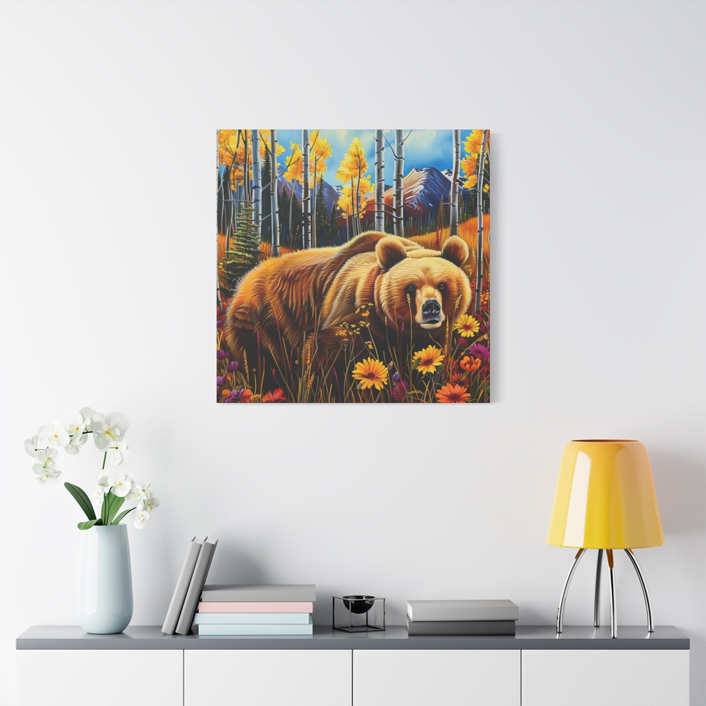 Brown Bear in Mountains smelling flowers