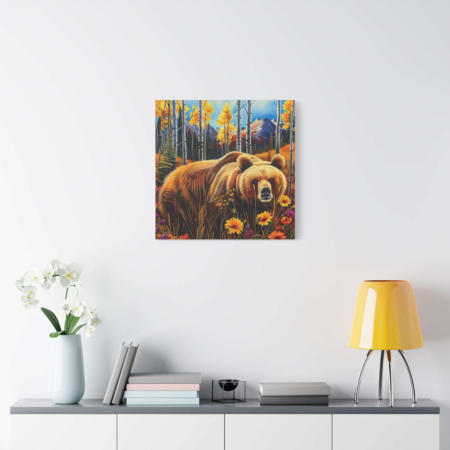 Brown Bear in Mountains smelling flowers