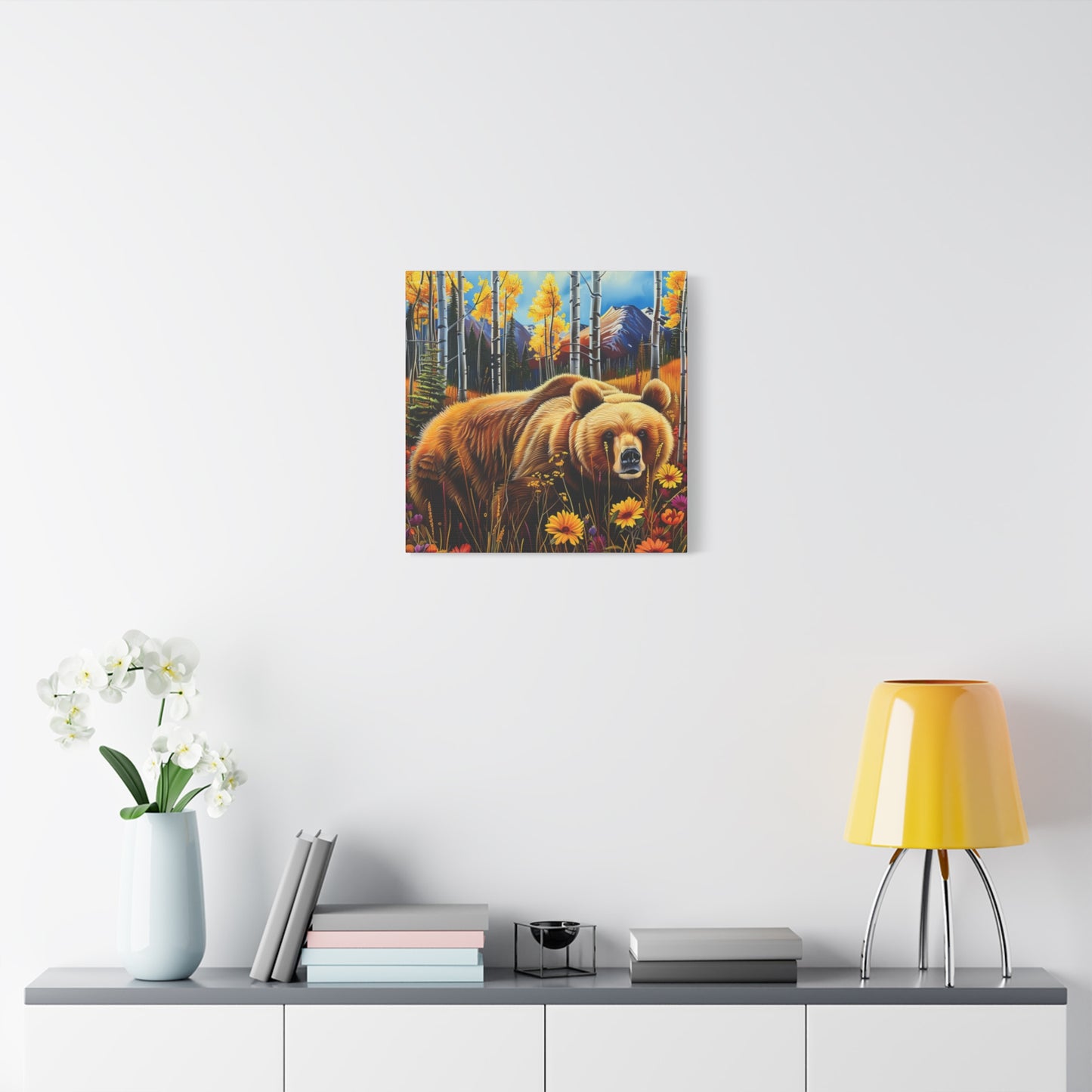 Brown Bear in Mountains smelling flowers